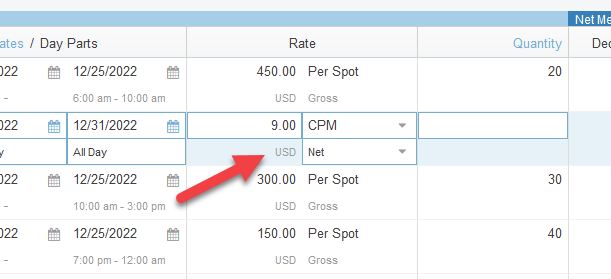 Screenshot of the line items tab in a proposal. The rate column is focused, with an arrow pointing to currency.